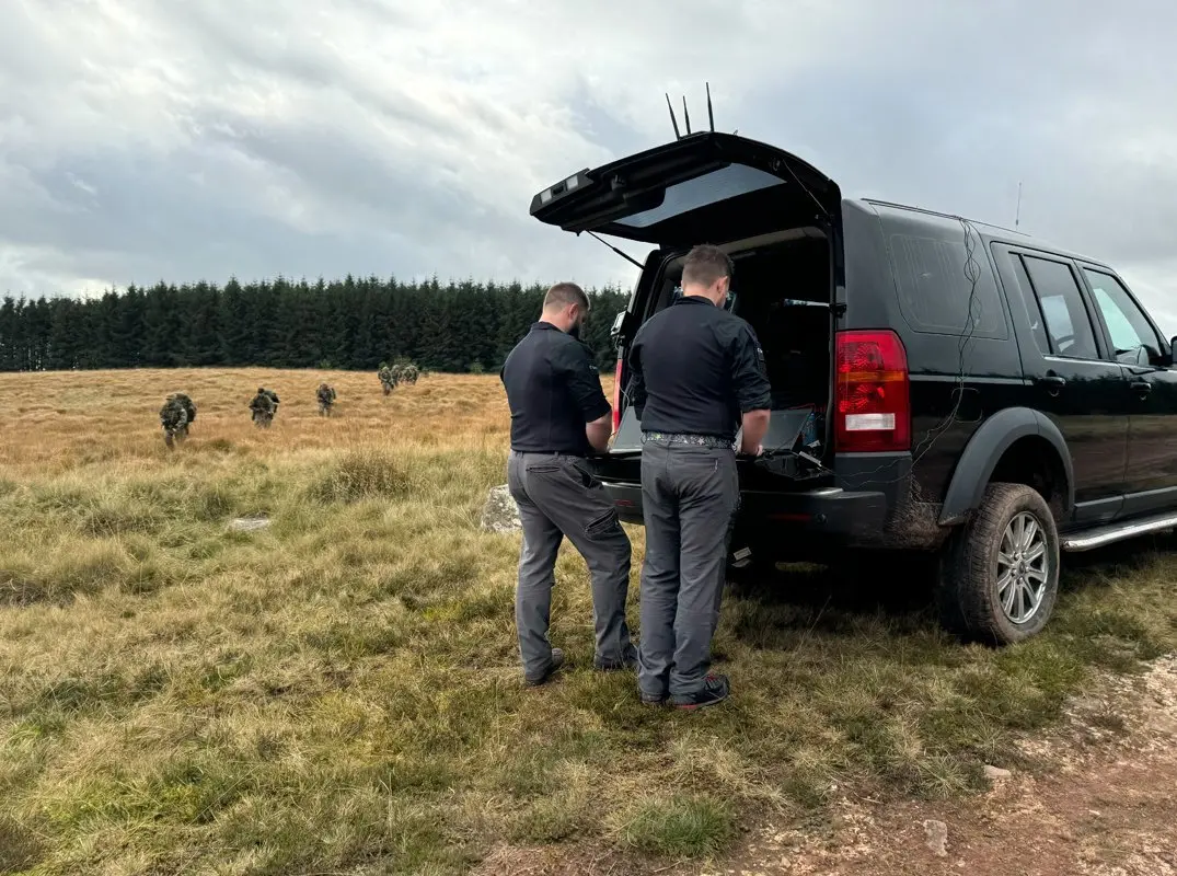 Team supporting a military exercise